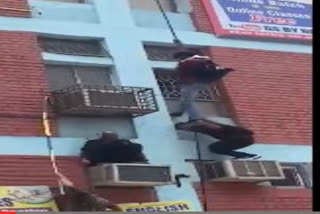Delhi high-rise fire: Terrified students escape precariously dangling from a rope