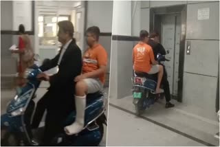 Man takes patient on Scooter  Scooter to second floor of the hospital  hospital  Wheelchair  പരിക്കേറ്റ മകനെ ഡോക്‌ടര്‍ക്ക് മുന്നിലെത്തിക്കാന്‍  ആശുപത്രിയുടെ അകത്ത് സ്‌കൂട്ടറുമായെത്തി  വഴി തടഞ്ഞ് ജീവനക്കാര്‍  വീല്‍ ചെയര്‍  രാജസ്ഥാന്‍  കോട്ട  രോഗി  സ്‌കൂട്ടര്‍  മഹാറാവു ഭീം സിങ് ഹോസ്പിറ്റലിൽ