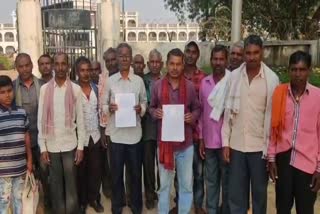 Villagers complain to the collector
