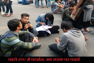 JNU students studying on the road