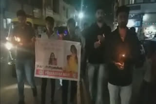 NSUI activists hold a candle march in porbandar