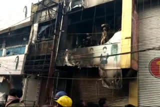 fire accident in clothe shop at vijayawada