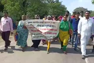 Flood affected women march in Sangli to protest forced debt collection