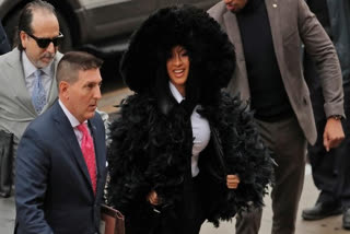 Cardi B makes dramatic court entry, dons large feather jacket