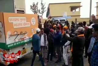 Modi and Shah banner in BJP promotional vehicle damaged in Dhanbad