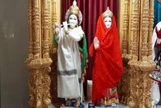 God dressed in warm clothes in Swaminarayan temple