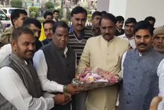 Food and Employment Minister Anoop Dhanak addresses people in Bahadurgarh