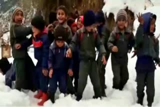 children-dancing-on-local-songs-in-snowfall-in-chamoli