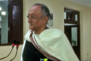 Amit Mitra, the finance minister of the state