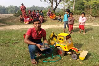 Madan Ray Made a model JCB, Motor Mechanic Madan Ray, Motor Mechanic Madan Ray Made JCB, Motor Mechanic Madan Ray Karimganj, মটৰ মেকানিক মদন ৰায় নিৰ্মিত জেচিবি, মটৰ মেকানিক মদন ৰায় জেচিবি, কৰিমগঞ্জ মটৰ মেকানিক মদন ৰায়