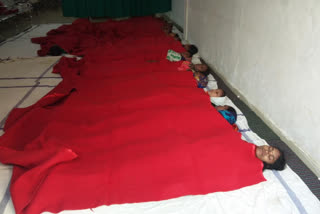 Women lie on ground after sterilization in Jabalpur district