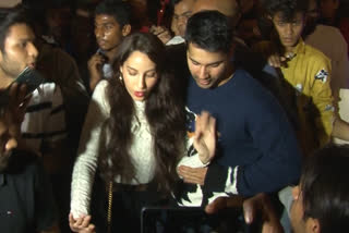 Varun Dhawan protects Nora Fatehi from mob frenzy