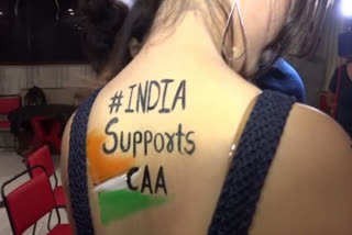 "India support CAA" message is fad among young girls & models in Vadodara  "India support CAA"  "India support CAA" message is fad among young girls  citizenship amendment act  caa protest  vadodara  ഇന്ത്യ പൗരത്വ നിയമത്തെ പിന്തുണക്കുന്നു എന്ന ടാറ്റുവുമായി യുവമോഡലുകൾ