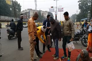 Members of Pride of Ujjaini serves tea and biscuits to people for free