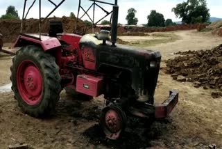 Naxalites burn a standing tractor