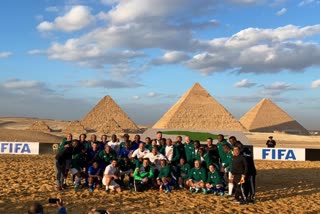 World and African football stars play a match in front of the Pyramids in Egypt