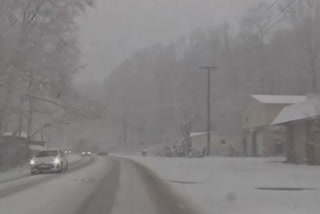 Officials in West Virginia were warning drivers on Tuesday morning to stay off snow-slickened roads if possible