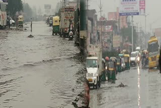 road submerged due to heavy rain in delhi due to which people's life affected