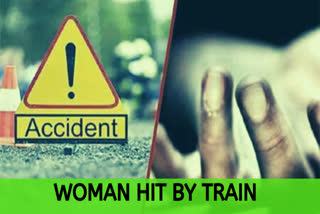 Woman walking near rail track with earphones on hit by train