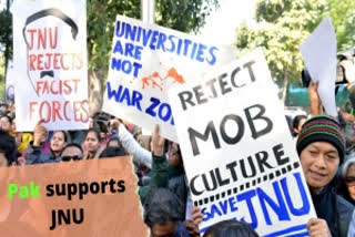 JNU students hold placards during their protest march