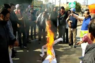 BJP workers clear the effigy of Captain