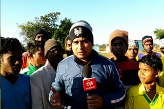 Adivasi children practice football during the cold season in Shahdol