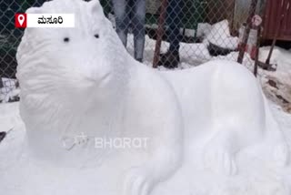 lion statue with snow in mussoorie