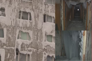 Various exteriors of multi-storey residential building covered by snow and ice