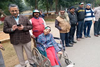 Handicapped boy in human chain