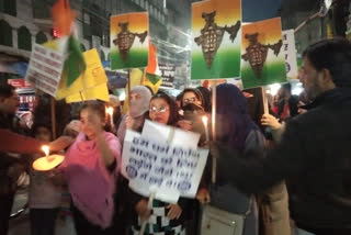 People take out candle march in caa protest against in lal kuan delhi