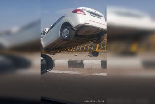 Driver out of control car on divider