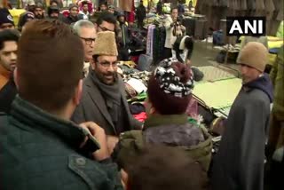 J&K: Union Minister MA Naqvi meets and interacts with locals at Lal Chowk in Srinagar