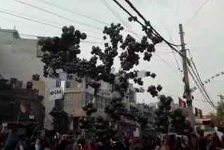 CAA-NRC: Protesters release black balloons from road blockade in Khureji