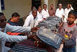 School bags distributed to 56 students