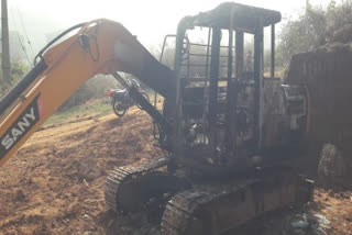 Suspected Maoists set ablaze a JCB used in road construction in Rayagada, Odisha