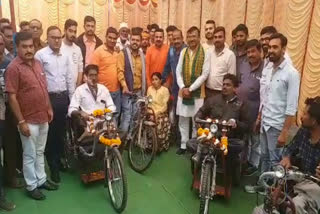 MP Gajendra Patel distributed motorized tri-cycle to Divyang