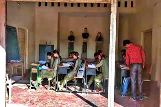 Teaching government school children insideThe council hall in haveri