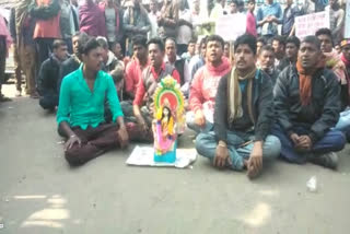 students protesting in front of the police station