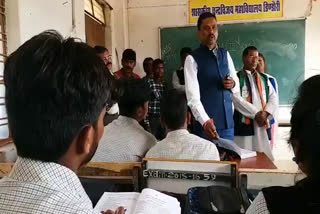 Minister Omkar Singh Markam taught students