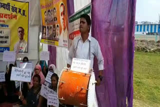 Candidates perform by playing drums