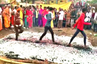 Devotees walk on burning coal