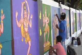 students paint on tanjavur temple walls