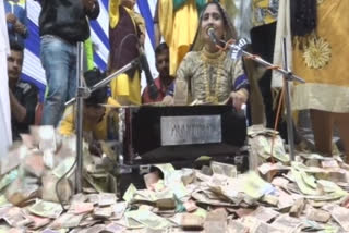 Currency notes, including dollars, showered