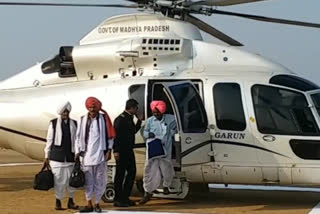 Three farmers arrive by helicopter