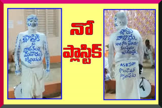 plastic awareness to the people painting on the body at medaram jatara