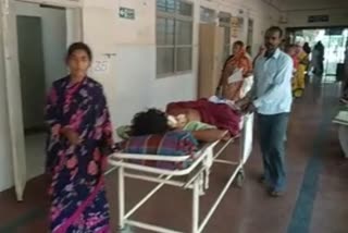 relatives-take-patient-in-stretcher