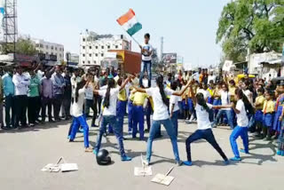 Students dancing and drama on the road at sangareddy
