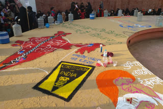 Artists create maps of India and various exhibits at an anti-CAA demonstration by artists at the Jaipur martyr monument