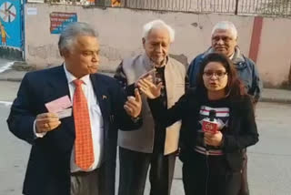 Voters cast votes at Old Rajendra Nagar Polling Booth in delhi