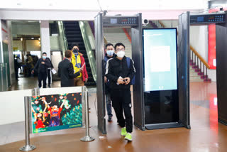 Passenger from Beijing pass through a scanner at Hazrat Shahjalal International airport in Dhaka